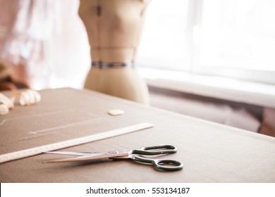 Still Life Photo Of A Suit Pattern Template With Tape Measure, Chalk And Scissors. Sewing And Tailoring Tools And Accesories.   