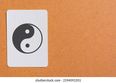 Still Life Photo Of A White Card Stock, With The Yin Yang Symbol Drawn On It