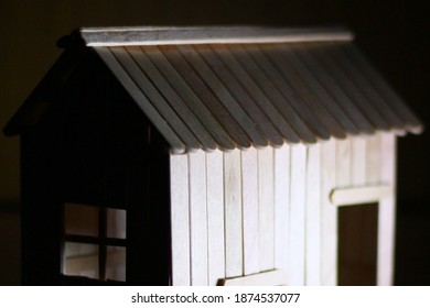 Still Life Photography ; Dark Toy Wooden House Made From Icecream Sticks