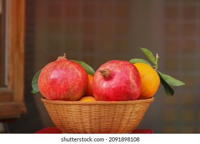 Still life with pomegranates and oranges.