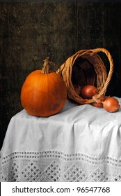 Still life with a pumpkin and onions