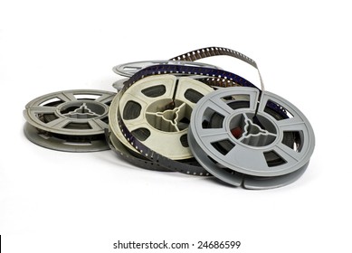 Still Life Of Random Group Of Dirty, Old 8mm Cine Film And Reels; Isolated On White Ground