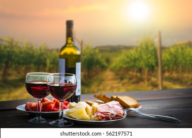 Still Life Red Wine ,cheese And Prosciutto. Romantic Dinner Outdoors