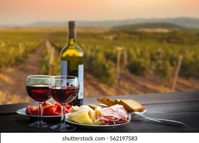 still life Red wine ,cheese and prosciutto. Romantic dinner outdoors - Powered by Shutterstock