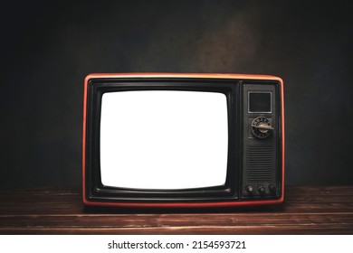 Still Life With Retro Old Red TV With Cut Out Screen In Dark Room