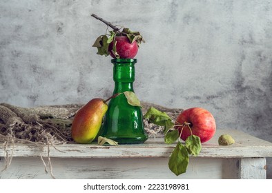 Still life with ripe fruit and a green bottle - Shutterstock ID 2223198981