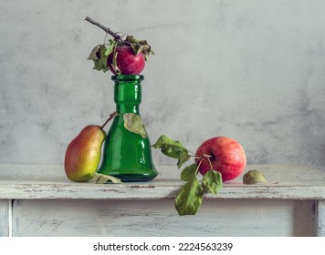 Still life with ripe fruit and a green bottle - Shutterstock ID 2224563239