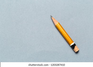 Still Life Of Short Worn Down  Pencil On Light Gray Background