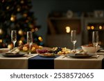 Still life shot of empty champagne flutes served with fruit and cheese platters on festive dinner table while Christmas lights glowing in blurred background, copy space