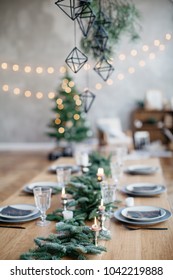 Still Life Shot Of Table Setting And Decoration Prepared For A Family Dinner, Christmas Celebration At Home, Christmas Tree On Background.