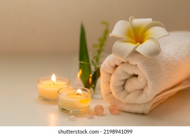 Still Life Spa Setting With Pink Stone Aroma Scent Candle And Plumeria Flower. Thai Spa Massage. Spa Treatment Cosmetic Beauty. Aromatherapy Care Relax Wellness. Aroma And Salt Scrub Healthy Lifestyle