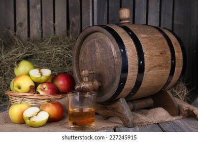 Still Life With Tasty Apple Cider In Barrel And Fresh Apples