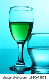 Still Life - Two Different Wine Glasses Over Blue Background