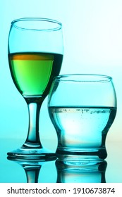 Still Life - Two Different Wine Glasses Over Blue Background