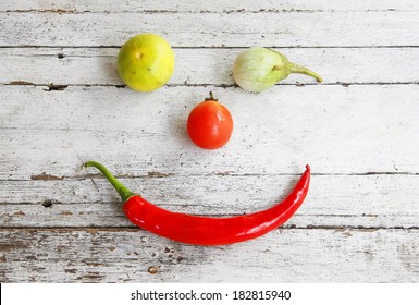 still life with vegetables on a wooden.smiley face.Flat lay - Powered by Shutterstock