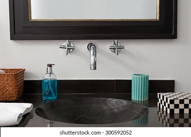 Still Life View Of A Quality Luxurious Bathroom With A Black Marble Elegant Expensive Sink In An Exclusive Bachelor Home, Bath Interior. Masculine Hotel Bathroom For Travelers, Indoors.