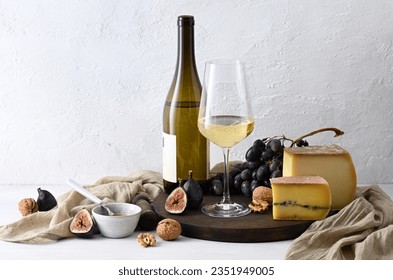 Still life with white wine, cheese and fruits - Powered by Shutterstock