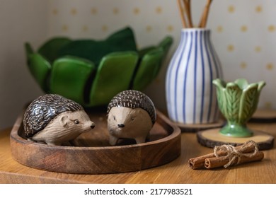 Still Life Witn Ceramic Hedgehog, Green Egg Holder, Cinnamon Stick And Green Ceramic Bowl, Wood Texture Kitchen Still Life