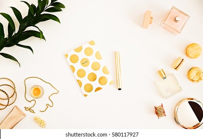 Still Life Woman's Glamour Beauty Products On White. Make Up, Perfumes, Polka Dots Notebook. Mock-up, Flat Lay For Beauty Blog, Copy Space, Gold And White