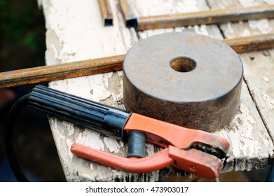 Still Life With Working Tools - Grindstone And Welding Holder On The Table