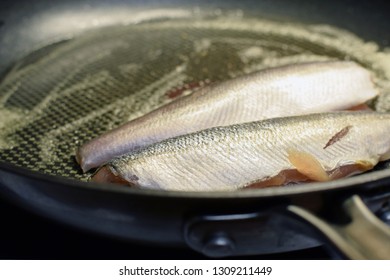 Still Raw Common Whitefish Fishes On Hot Frying Pan. Copy Space.