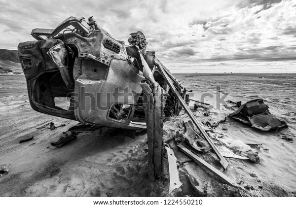 Still visible the effects of the 2015 flooding in\
North Chile at Chañaral beach. A car remains abandoned above the\
ground, rusty by the aggressive environment in the outdoors at\
Atacama Desert, Chile\
