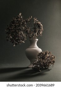 Stilllife with dry flowers in a vase on a grey background .  Fine art . Poster  . 
