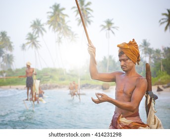 Stilt Fishermen In Sri Lanka Concept