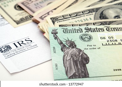 Stimulus economic tax return check and USA currency