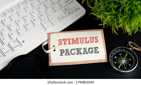 STIMULUS PACKAGE Words On Label Tag With Compass, Keyboard And Green Grass, Conceptual