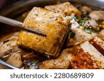 Stinky tofu hotpot is a famous Taiwanese street food known for its unique smell and flavor. It is a popular choice among locals and tourists alike, especially during the colder months.