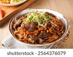 Stir fried Beef River with Swiss Sauce served in bowl isolated on napkin side view of hong kong food on wooden background