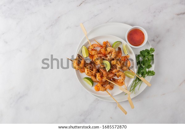 Stir fried
Chilli barbecued prawns on a
scewer