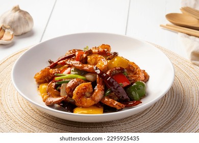 Stir fried crispy shrimp with cashew nuts and sweet pepper in white plate.Thai food not spicy. - Powered by Shutterstock