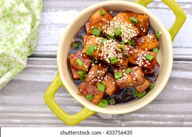 Stir Fried Diced Tofu With Soy Sauce, Sesame Seeds And Chives