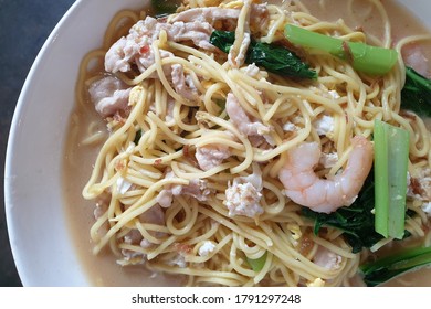 Stir Fried Hainanese Noodles With Pork Meat And Shrimps. Famous Penang Hawker Food.