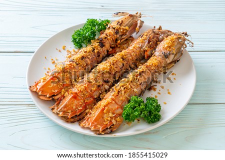 Stir Fried Mantis Shrimp with Garlic on white plate