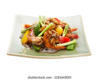 Stir fried prawns with black pepper corn with beel pepper and spring onion. 45 degree angle.  Isolated on whie background.