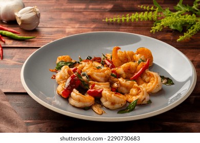 Stir fried shrimp with thai basil on grey plate,thai spicy food - Powered by Shutterstock