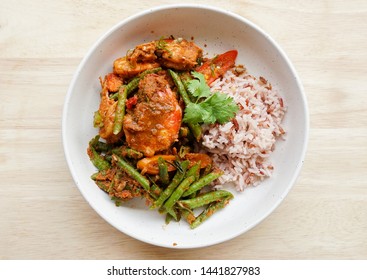 Stir Fried Shrimps And Yard Long Beans With Red Curry Paste On A Wooden Board, Top Down View Of Thai Local Food In A Bowl