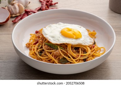 Stir Fried spaghetti with Basil and Minced Pork with Dried Chili and fried egg,Pad Kra Pao