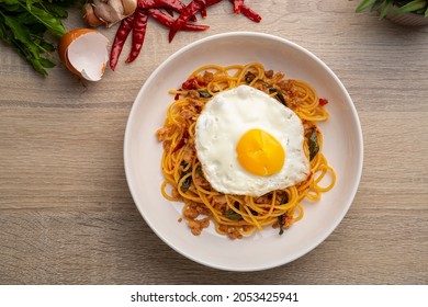 Stir Fried spaghetti with Basil and Minced Pork with Dried Chili and fried egg,Pad Kra Pao.Top view