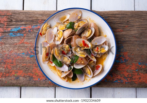 Stir fried Spicy\
Clam (Surf , Short necked , Carpet , Venus shell, Baby clam) with\
Thai Holy Basil , Asian\
Food