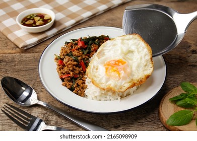 stir fried thai basil with minced pork with fried egg , pad kra pao - Shutterstock ID 2165098909