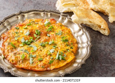 Stir Fried Veggie Omelet With Mix Vegetables. Indian Nepali Style Masala Omelette Close Up In The Plate On The Table. Horizontal
