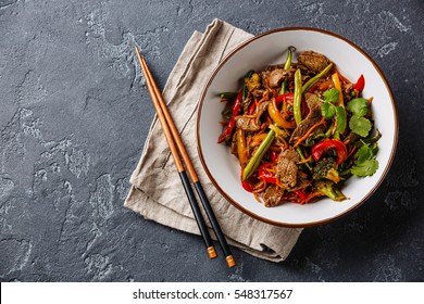 Stir Fry Beef With Vegetables In Bowl On Dark Stone Background