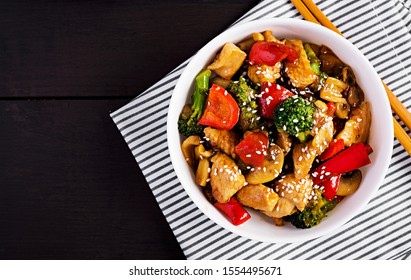 Stir Fry With Chicken, Mushrooms, Broccoli And Peppers. Chinese Food. Top View, Overhead