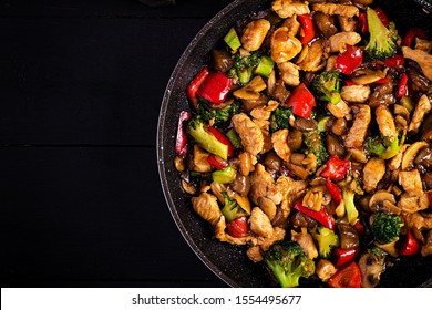 Stir Fry With Chicken, Mushrooms, Broccoli And Peppers. Chinese Food. Top View, Overhead