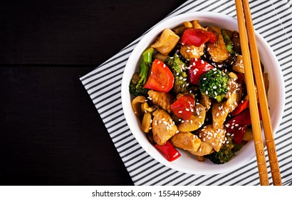 Stir Fry With Chicken, Mushrooms, Broccoli And Peppers. Chinese Food. Top View, Overhead