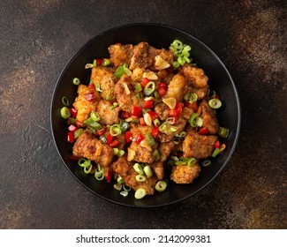 Stir Fry Salt And Pepper Pork Loin With Herbs In Black Bowl. Asian Food